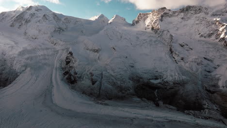 Incredible-morning-Gornergrat-Zermatt-Glacier-ice-crevasse-river-Swiss-Alps-top-The-Matterhorn-summit-ski-resort-landscape-scenery-aerial-drone-autumn-Railway-Switzerland-backward-reveal-motion