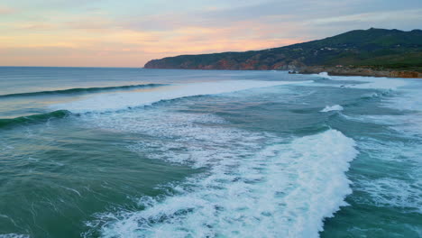 beautiful calm ocean twilight with foamy waves on seashore. aerial sea water