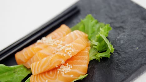 sushi served on tray with chopsticks