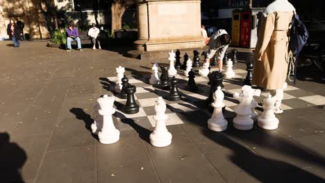 people playing giant chess outdoors in melbourne