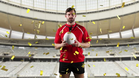 jugador de rugby profesional de pie frente a un estadio con confeti cayendo