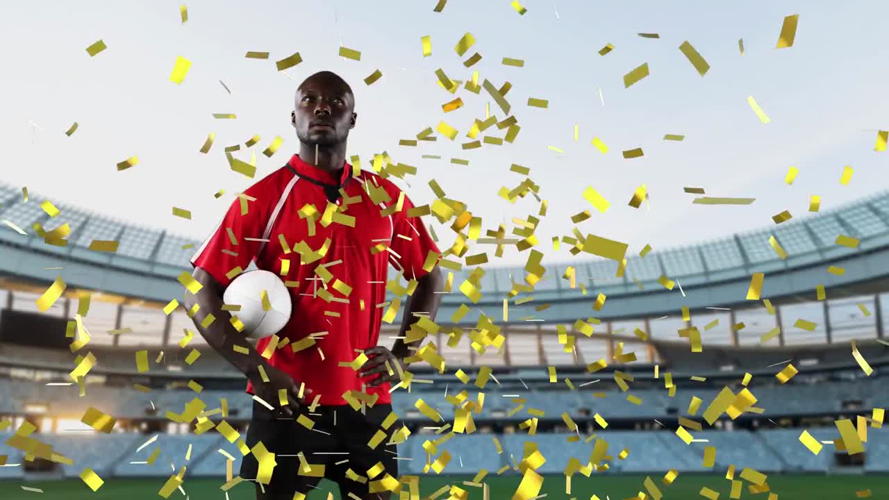 프로 럭비 선수 가 콘페티 가 떨어지는 경기장 앞 에 서 있다