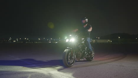 man riding motorcycle at night