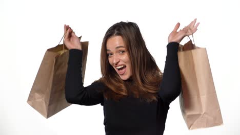 girl enjoy shopping. happy young woman with shopping bags on white background. let's go shopping concept