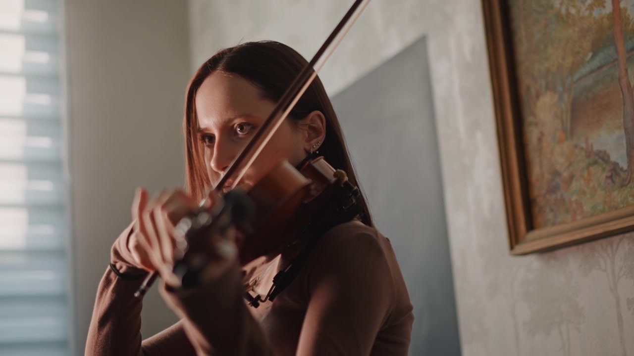 White woman demonstrating violin technique closeup, studio light and window backdrop, detailed bowing and finger placement, coach guiding posture and intonation, focused professional practice