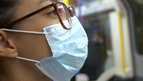 Passenger-wearing-a-face-mask-on-underground-train