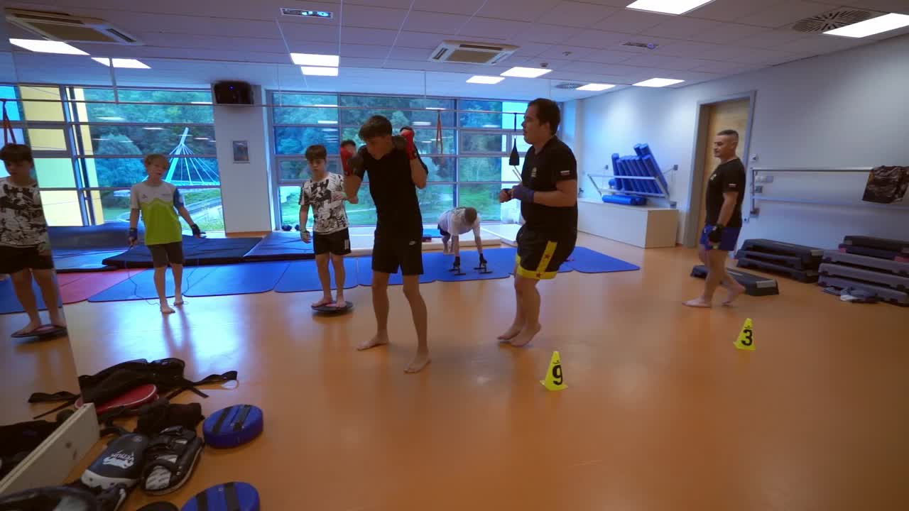 Teenagers Engaging in Boxing and Fitness Training at a Gym