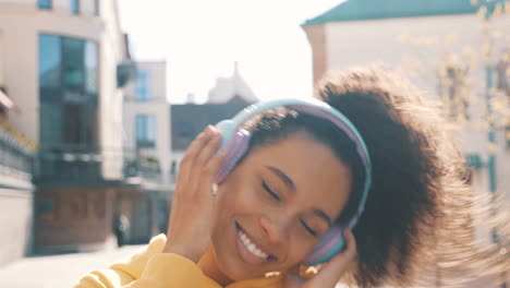 happy woman listening to music outdoors