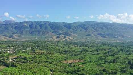 Aerial-View-of-Spectacular-Landscape-of-Sierra-De-Neiba-Mountain-Range-and-Lowlands-of-Baoruco-Tropical-Forest,-Dominican-Republic