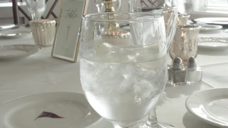 classy water glasses on the table of an upscale wedding reception