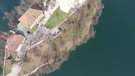 aerial view of the island with small church located in the middle of the lake bled, slovenia