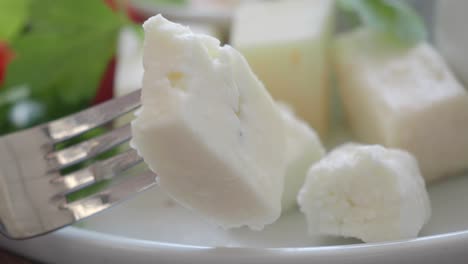 close up of feta cheese on a fork