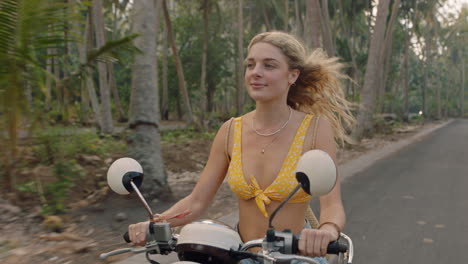 travel woman riding motorcycle on tropical island road trip enjoying motorbike ride happy independent woman exploring freedom on vacation