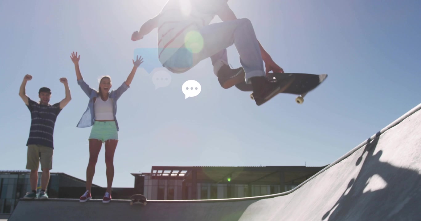 technology skateboarders cheering as chat bubbles motivating launching aerial trick above bowl