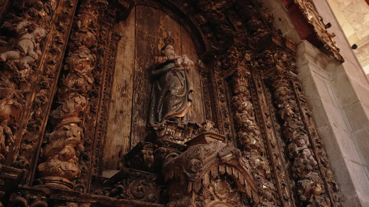 Baroque altar with ornate wood carving and religious sculpture