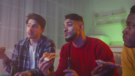 friends enjoying pizza and beer