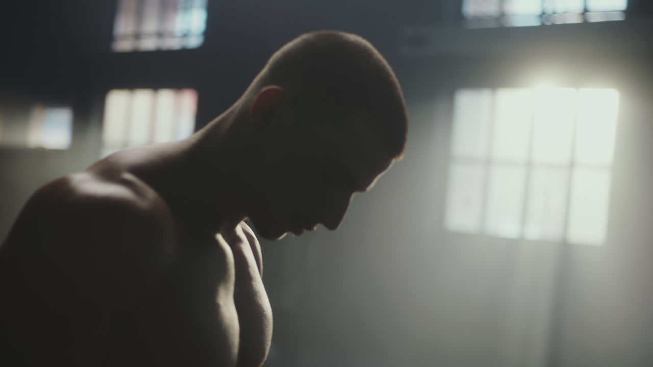 Muscular Man Working Out in Gym