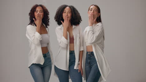 three friends having fun together in a studio