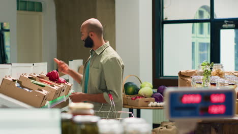 Customer-examining-fresh-natural-carrots