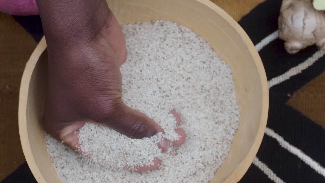 Teff grain from Africa, alternative gluten-free flour for baking and cooking. over a tipical african pattern and veggies.