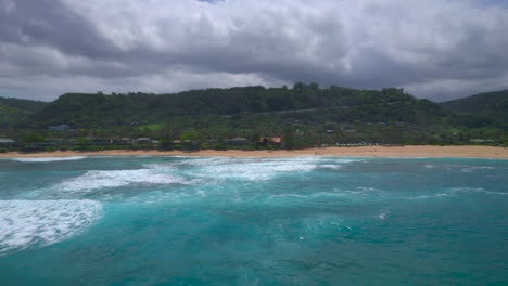 Water-to-shore-aerial-view-of-Oahu-Hawaii-North-Shore-beach