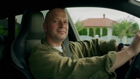 man driving a car