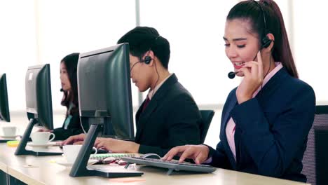 business people wearing headset working in office