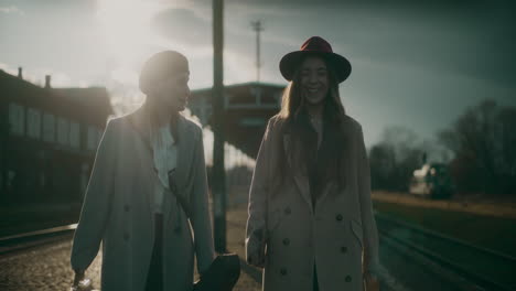 Two-Women-Walking-Railway-Station