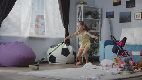 child cleaning up a messy room