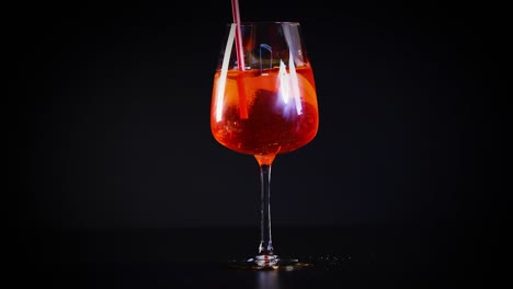 aperol spritz glasses on a dark background