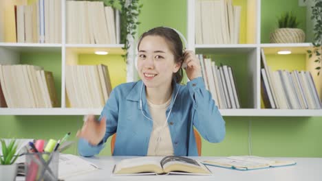 Young-Asian-woman-getting-good-news-from-camera.