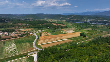 Drone-flying-over-idyllic-rural-farmland-fields,-summer-day-in-Istria,-Croatia