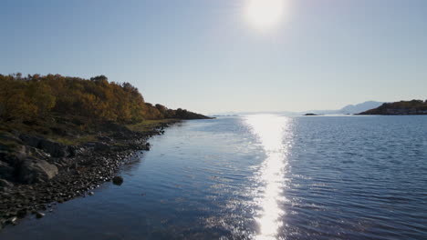 glistening water with sunlight reflection on senja island in norway