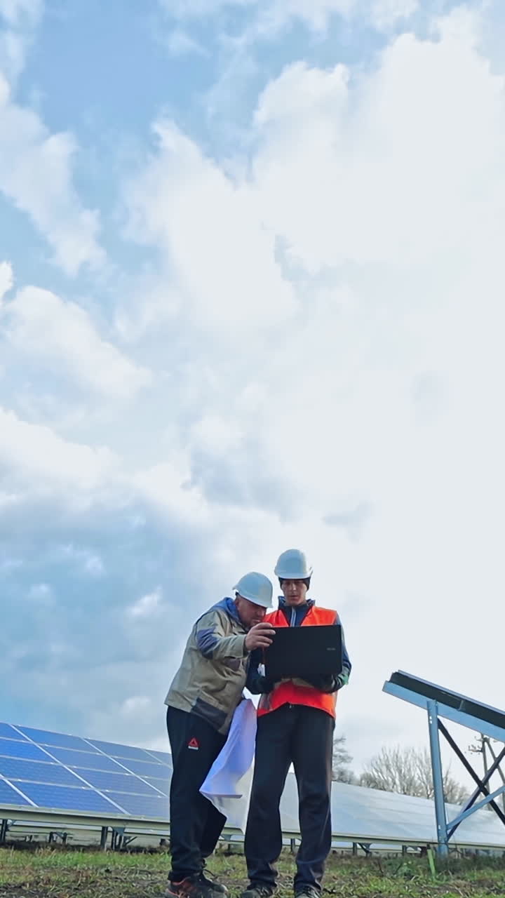 Solar Panel Engineers Reviewing Plans