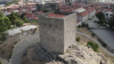 aerial footage of guarda old medieval city with stone fortifications and christian cathedral