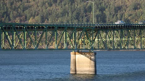 cars driving the road on steel truss structure, hood river bridge, usa