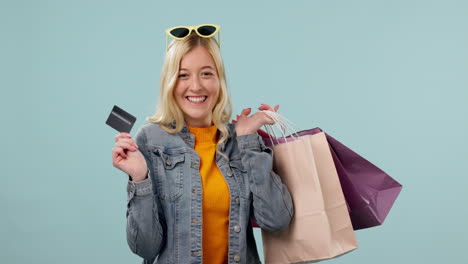 Shopping,-bag-and-face-of-woman-with-credit-card