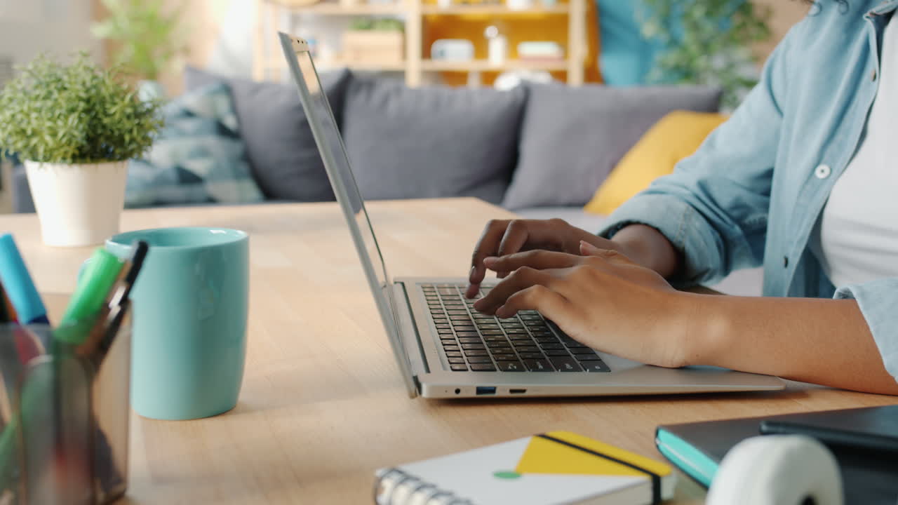 Woman Working on Laptop at Home