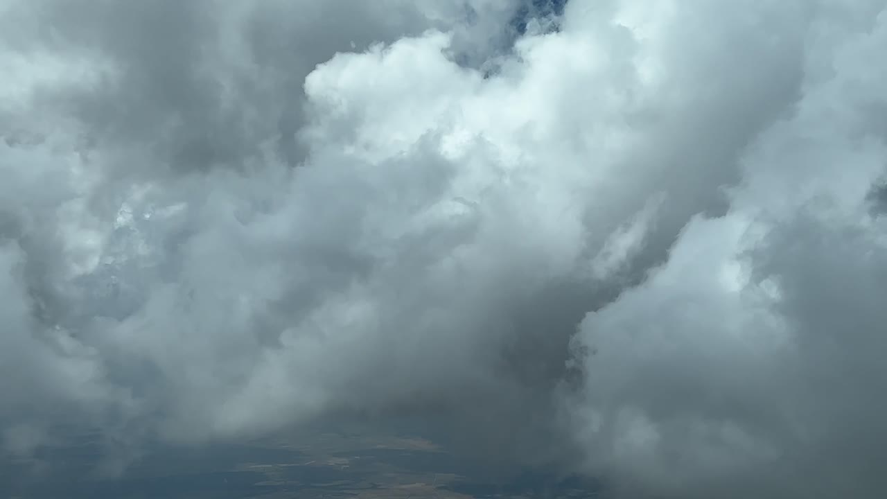 An unique pilot&rsquo;s perspective: flying trough a sky full of tiny cumulus clouds, recorded from a jet cabin while flying at 9000m high