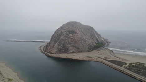 aerial view of morro rock and beach in morning fog