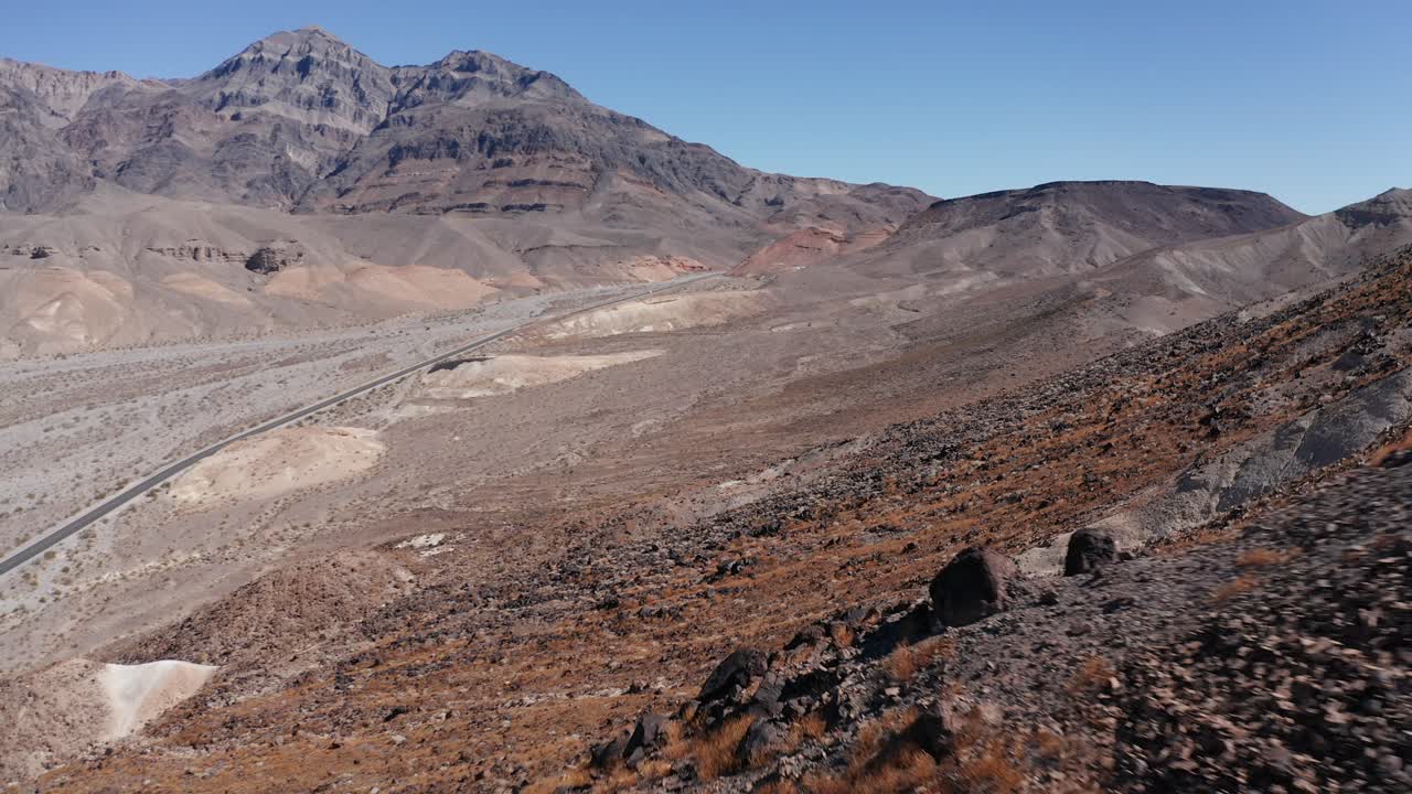 Low aerial shot flying over the rugged desert landscape of Death Valley, California. 4K