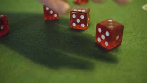 dice rolled on green casino table - slow motion