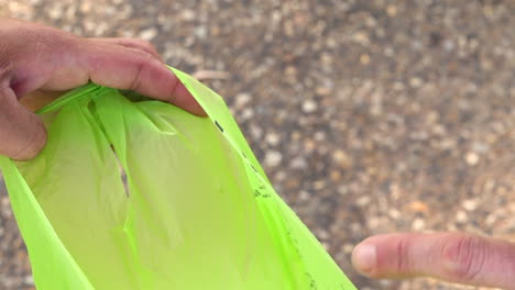 plate of plant-based food being tipped into garbage bag, close up