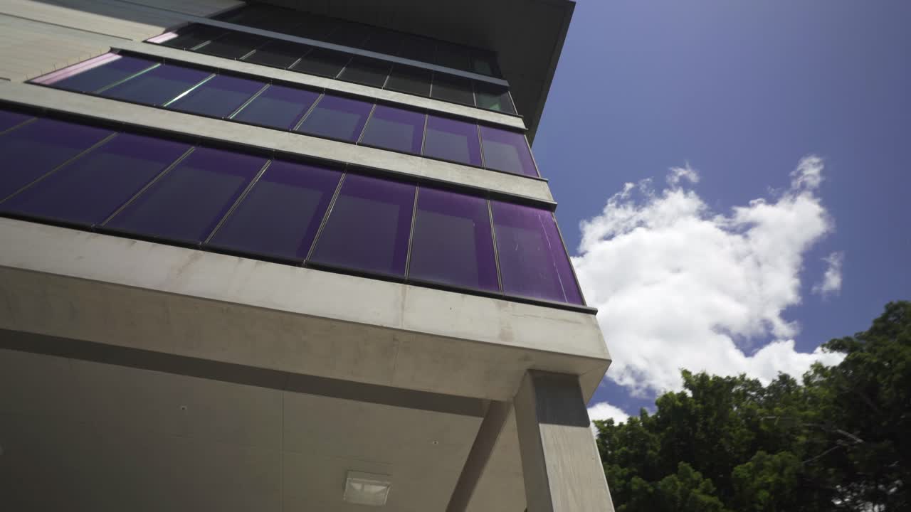 blue sky with cloud reflecting on building's window