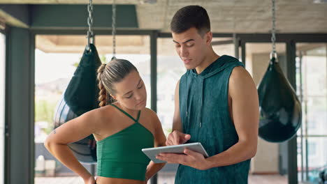 Tablet,-coach-and-woman-planning-workout