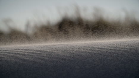 sand blows over a sand dune, extreme closeup