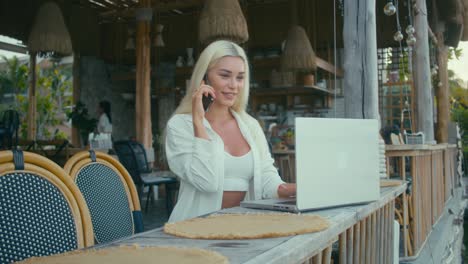 woman working remotely at a cafe