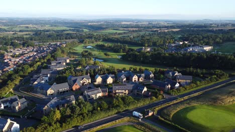 sunrise over ramside hall housing estate near ramside golf course in county durham - aerial drone 4k hd footage lower