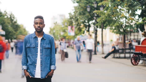 man standing on a city street