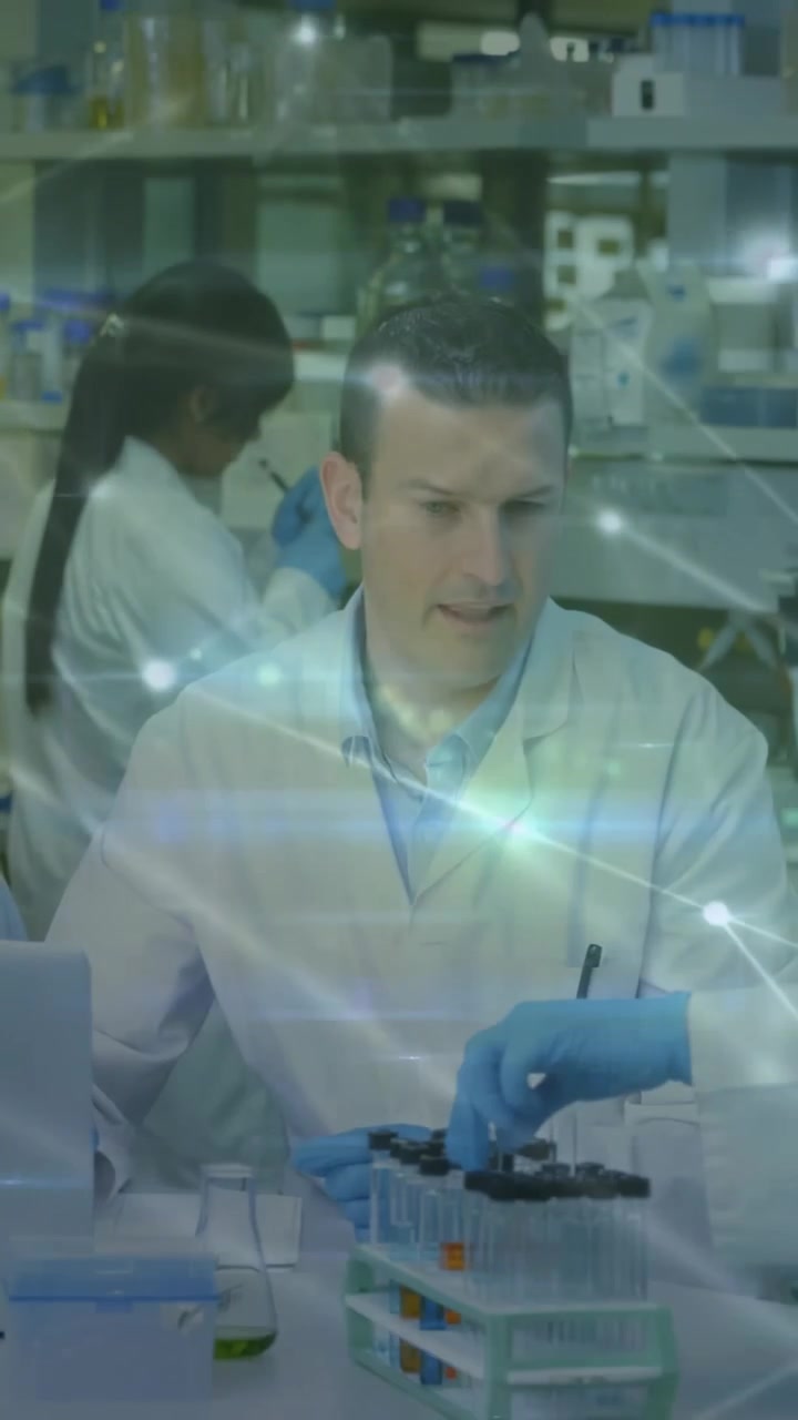 Vertical video: Lead reacting as gloved hand handing sample, processing lab tests, overlay showing